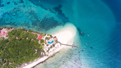 Idyllic Paradise tropical beach Prison island Zanzibar, clear turquoise water, aerial view, travel vacation background.