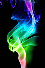 Obraz premium Colored smoke isolated on a black background