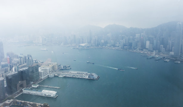 The view of The docks in Victoria Harbour from the 100th floor of International Commerce Center tower in Hong Kong