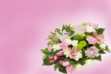 Fototapeta na wymiar Beautiful flowers bouquet on pink background with copyspace.