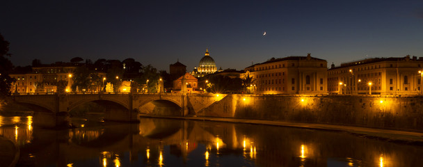 Fototapeta na wymiar Panoramic view of Rome and Tiber at night with Saint Peters Basi