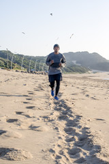 Jogger approaching along the beach