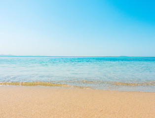 Beach and tropical sea soft wave of blue clear sky ocean on sandy. Seascape Background