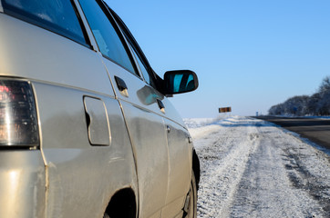 Fototapeta premium Car on a roadside on winter
