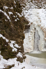 Fototapeta na wymiar Frosty morning at the waterfalls Rufabgo. Adygea