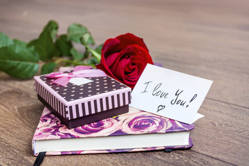 Rose, gift box and book. Valentines Day background