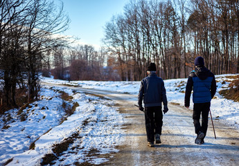 Grandfather and grandson walking outdoor