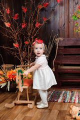 beautiful little girl with toy smiling at the camera