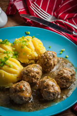 Meatballs with potatoes in dill sauce.