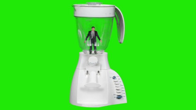 green screen concept of a businessman in a blender getting ready to be liquefied.