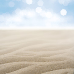 Fototapeta na wymiar Sand beach and sea with blurred lights in summer day
