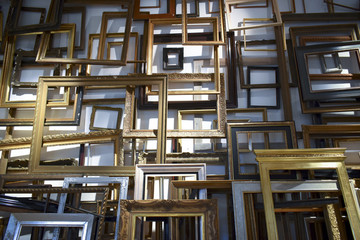 A large amount of empty picture frames in a flat