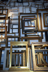 A large amount of empty picture frames in a flat