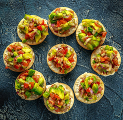 Salsa canape cracker appetizers with soft cheese