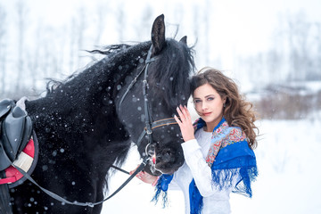 portrait of a beautiful young woman in a fashionable blue scarf,