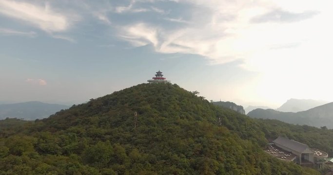 Beautiful aerial shot of oriental Tianmen shan temple on top of Tianmen mountain in Zhangjiajie city hunan province China. Top view of famous Tianmen Mountain National Park.
