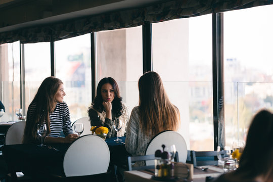 Girls Having Fun Out In Town At Favorite Restaurant, Talking, Sh