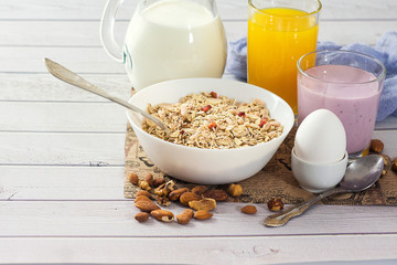 Healthy food muesli with banana, nuts and milk for breakfast