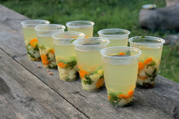 Fish soup in a glass on the table