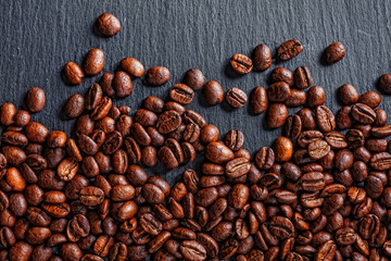 Coffee cup, spices and chocolate on wooden table texture with co