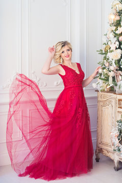 young beautiful girl in a red evening dress