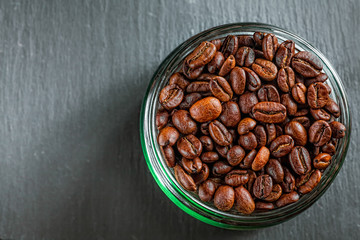 Coffee mug of coffee beans on Dark vintage background