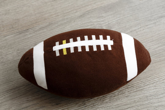 rugby ball toy for children on the wooden floor