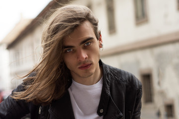 Attractive Young Man With Long Hair and Blue Eyes.