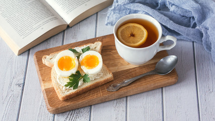 breakfast with boiled eggs and crispy toasts, closeup