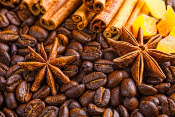 Coffee cup, spices and chocolate on wooden table texture with co