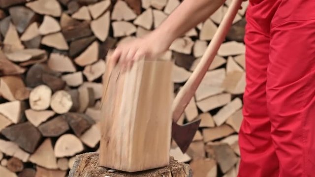 Man chopping firewood - working with a large axe