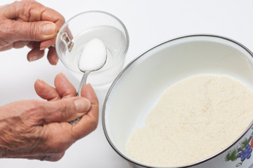 Colombian arepa dough preparation: Add salt to warm water