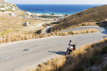 Girl on scooter in Greece