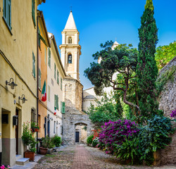 The yard with many flowers in the ancient town of Ventimiglia. Italy.