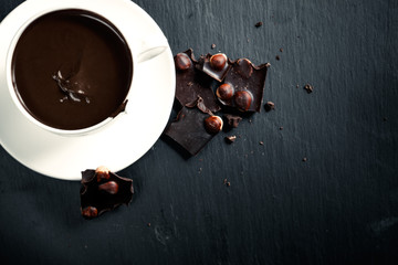 Hot chocolate with bitter chocolate. On a black chalkboard