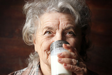 Grandmother drinks milk