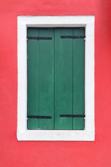 Closed green window shutters