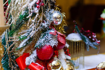 Christmas tree background and Christmas decorations with snow, blurred, sparking, glowing. Happy New Year and Xmas theme