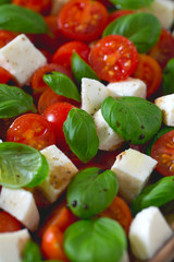 caprese salad on dark wooden surface