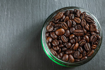 Coffee mug of coffee beans on Dark vintage background