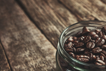 Coffee mug of coffee beans on Dark vintage background