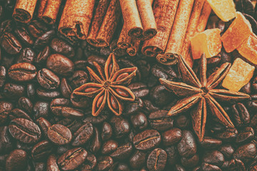Coffee cup, spices and chocolate on wooden table texture with co
