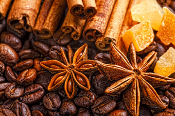 Coffee cup, spices and chocolate on wooden table texture with co