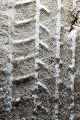 trace of the car in the snow as a background