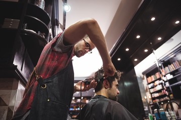 Man getting his hair trimmed with trimmer