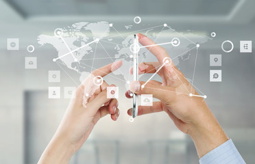 Network with his mobile phone . Mixed media