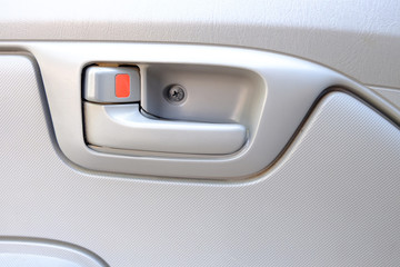 Fototapeta premium inside car door lock beige color close up..