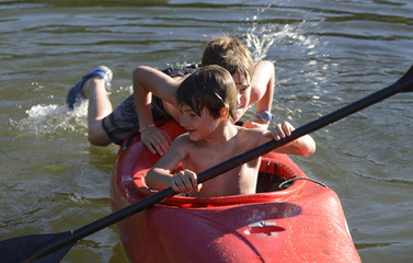 Brothers Enjoying the Kayak on Vacation 