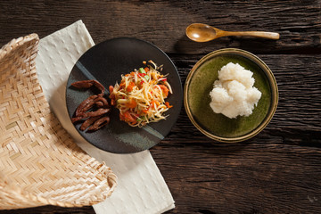 papaya salad with rice stick and earthen steamer