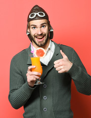 Fototapeta premium bearded pilot with cocktail in glass
